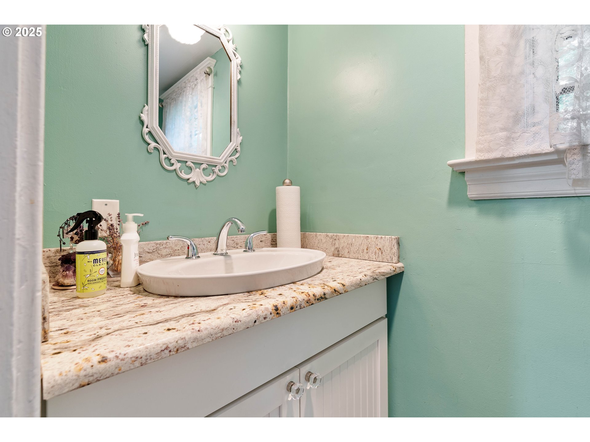 3906 South Kelly Avenue Portland, OR 97239 - Photo 21 of 42 a bathroom with a granite countertop sink and a mirror