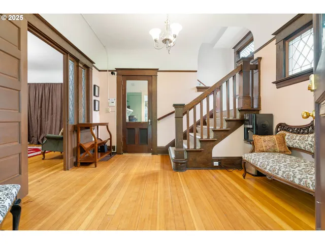 a view of a livingroom with furniture and floor to ceiling windows