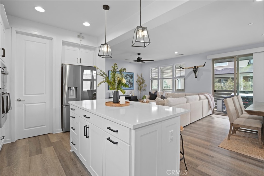 58 Vasto Street Rancho Mission Viejo, CA 92694 - Photo 14 of 66 an open kitchen with a table and chairs