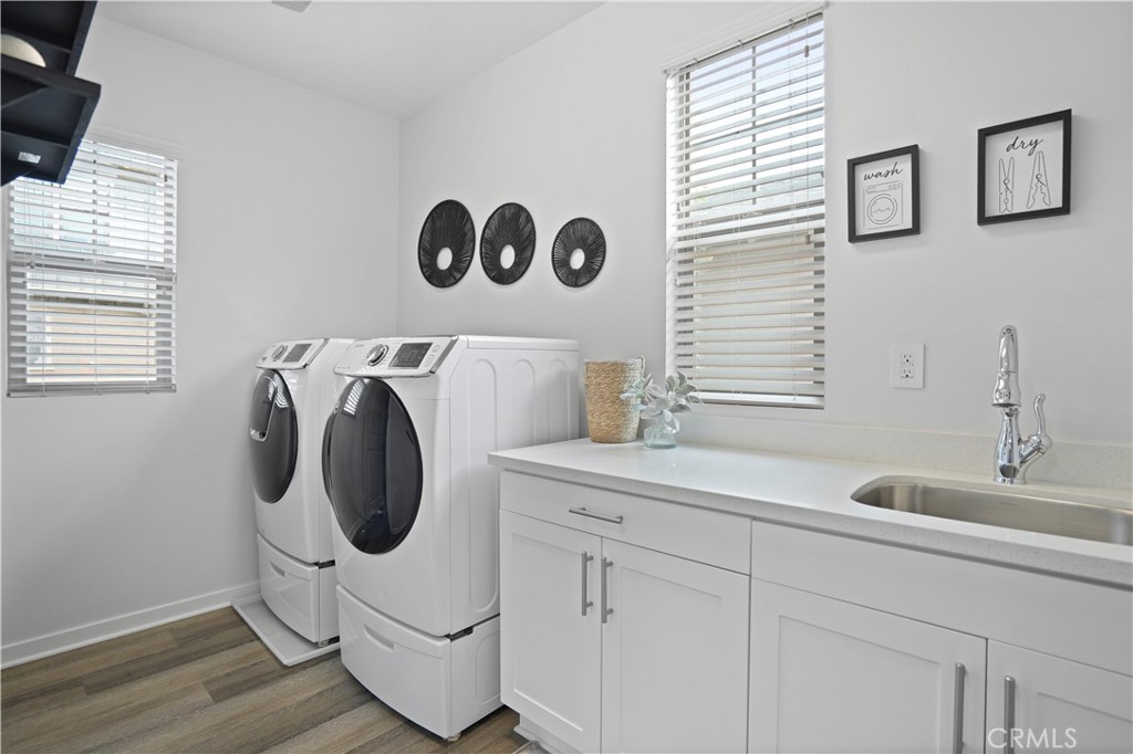 58 Vasto Street Rancho Mission Viejo, CA 92694 - Photo 18 of 66 a utility room with sink dryer and washer