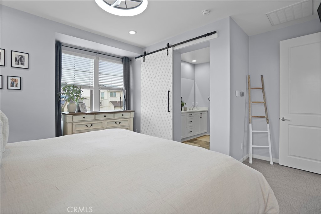 58 Vasto Street Rancho Mission Viejo, CA 92694 - Photo 20 of 66 a bedroom with a large bed and a window