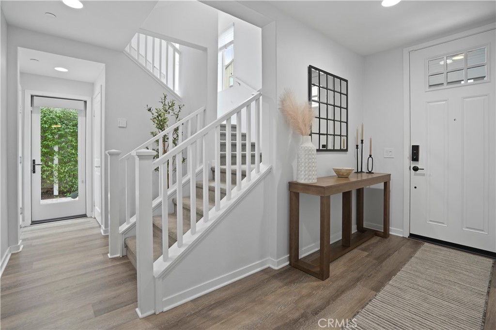 58 Vasto Street Rancho Mission Viejo, CA 92694 - Photo 2 of 66 a view of entryway with wooden floor and stairs