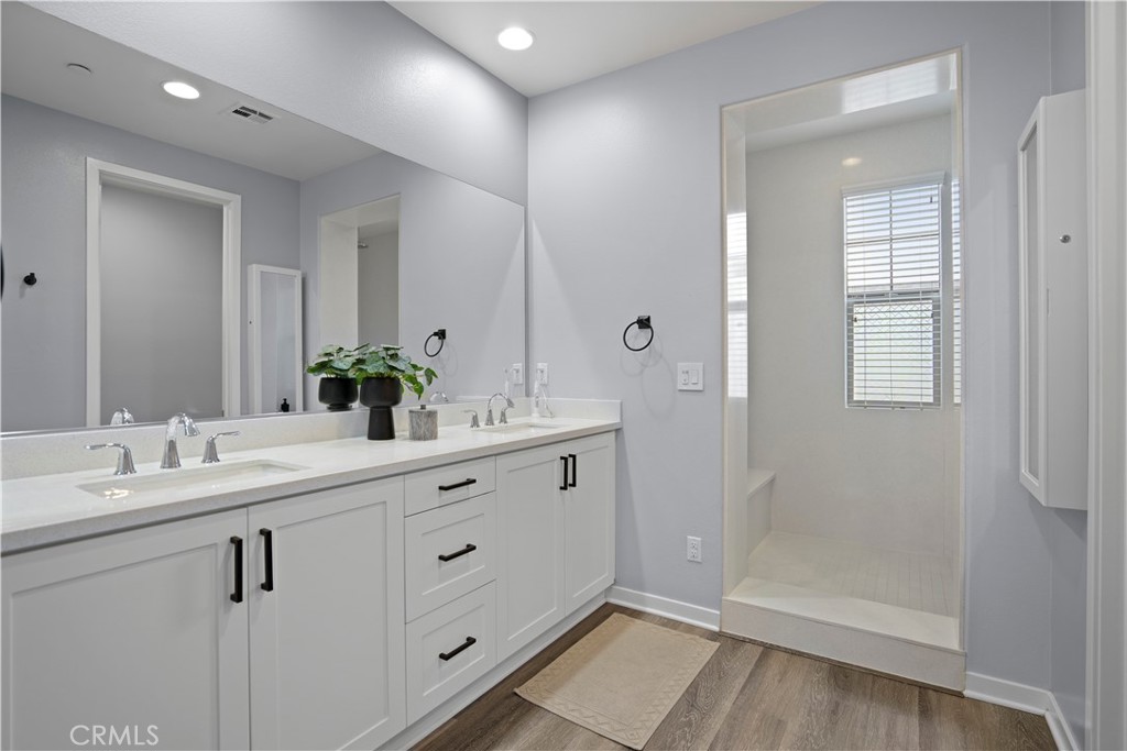 58 Vasto Street Rancho Mission Viejo, CA 92694 - Photo 21 of 66 a bathroom with a double vanity sink mirror and shower