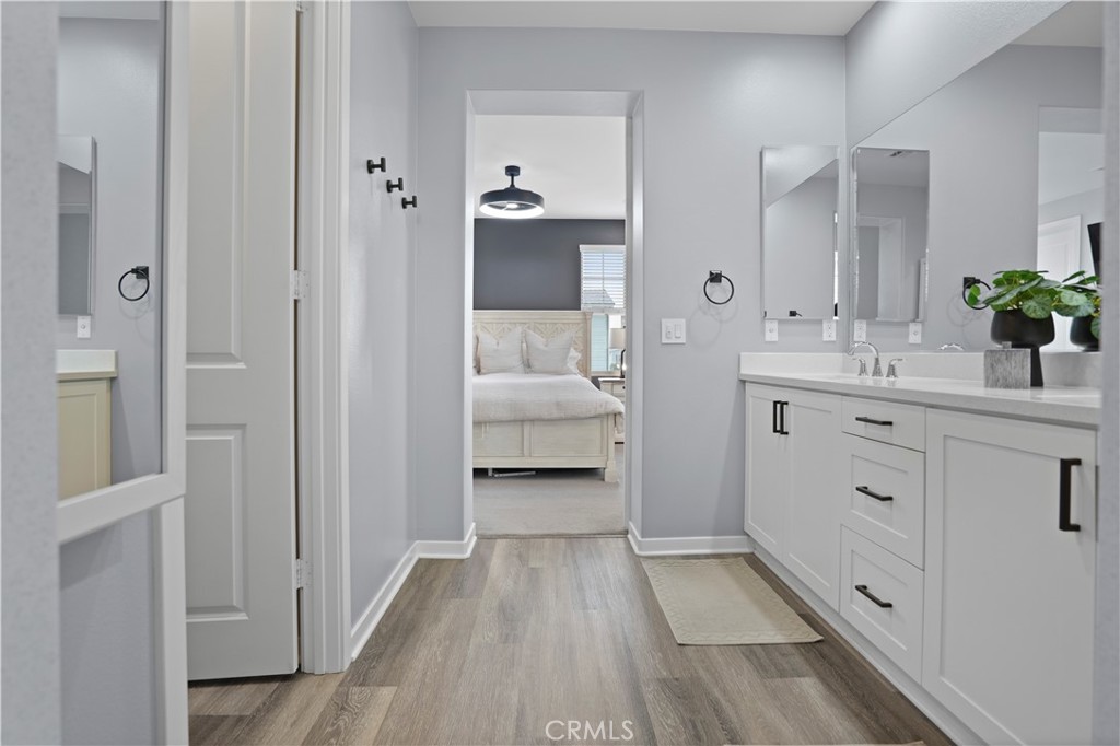 58 Vasto Street Rancho Mission Viejo, CA 92694 - Photo 22 of 66 a bathroom with a double vanity sink and mirror