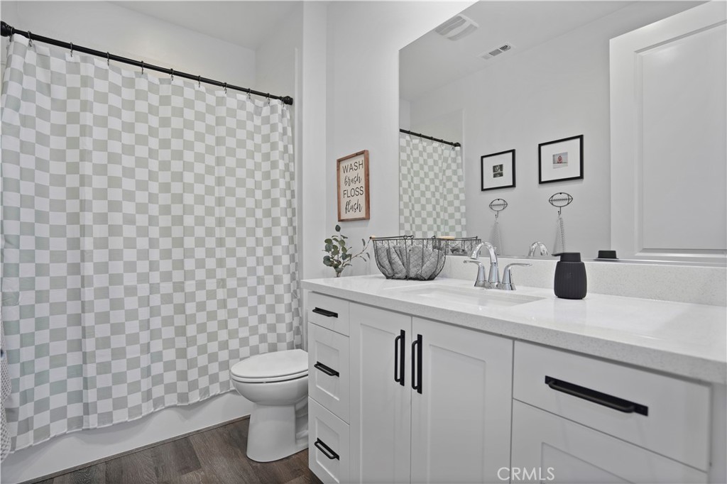 58 Vasto Street Rancho Mission Viejo, CA 92694 - Photo 25 of 66 a bathroom with a sink a toilet and mirror