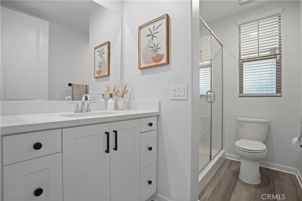 58 Vasto Street Rancho Mission Viejo, CA 92694 - Photo 6 of 66 a bathroom with a toilet sink and mirror