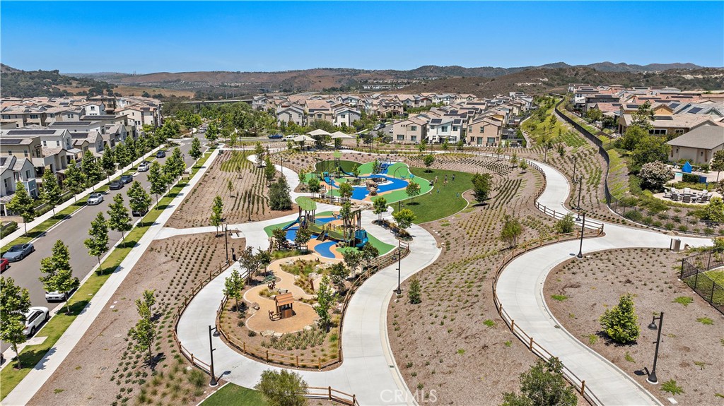 58 Vasto Street Rancho Mission Viejo, CA 92694 - Photo 62 of 66 an aerial view of a swimming pool with a mountain
