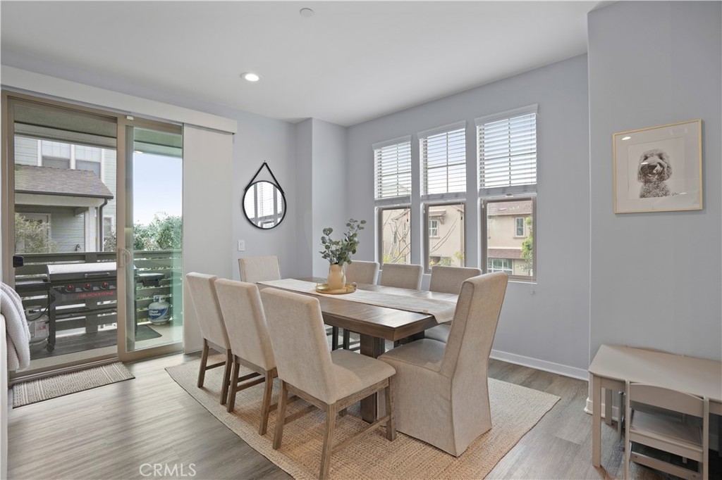 58 Vasto Street Rancho Mission Viejo, CA 92694 - Photo 10 of 66 a view of a dining room with furniture window and wooden floor