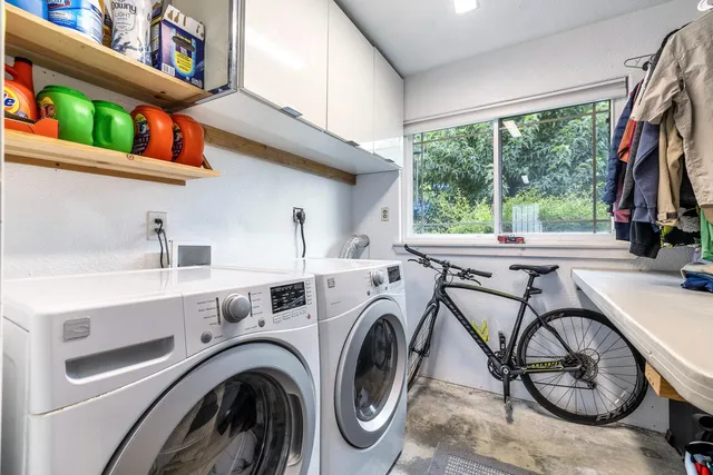 a view of storage and utility room with washer and dryer