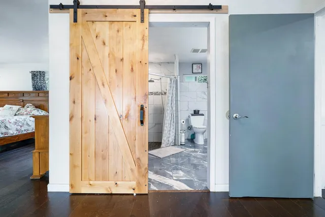 a view of a bathroom that has a sink toilet and shower