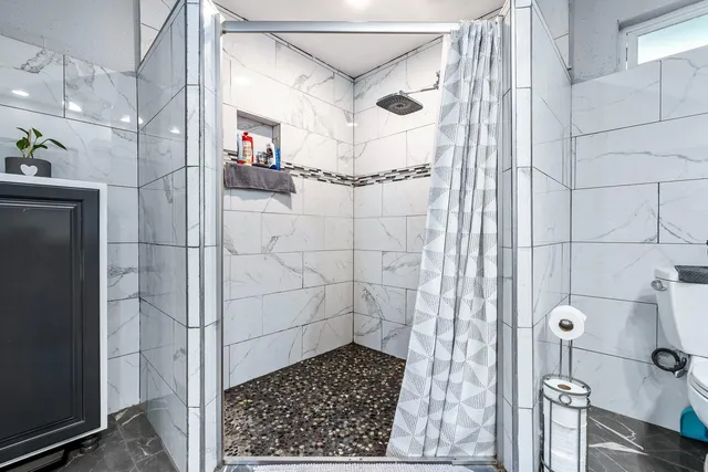 a bathroom with a glass shower