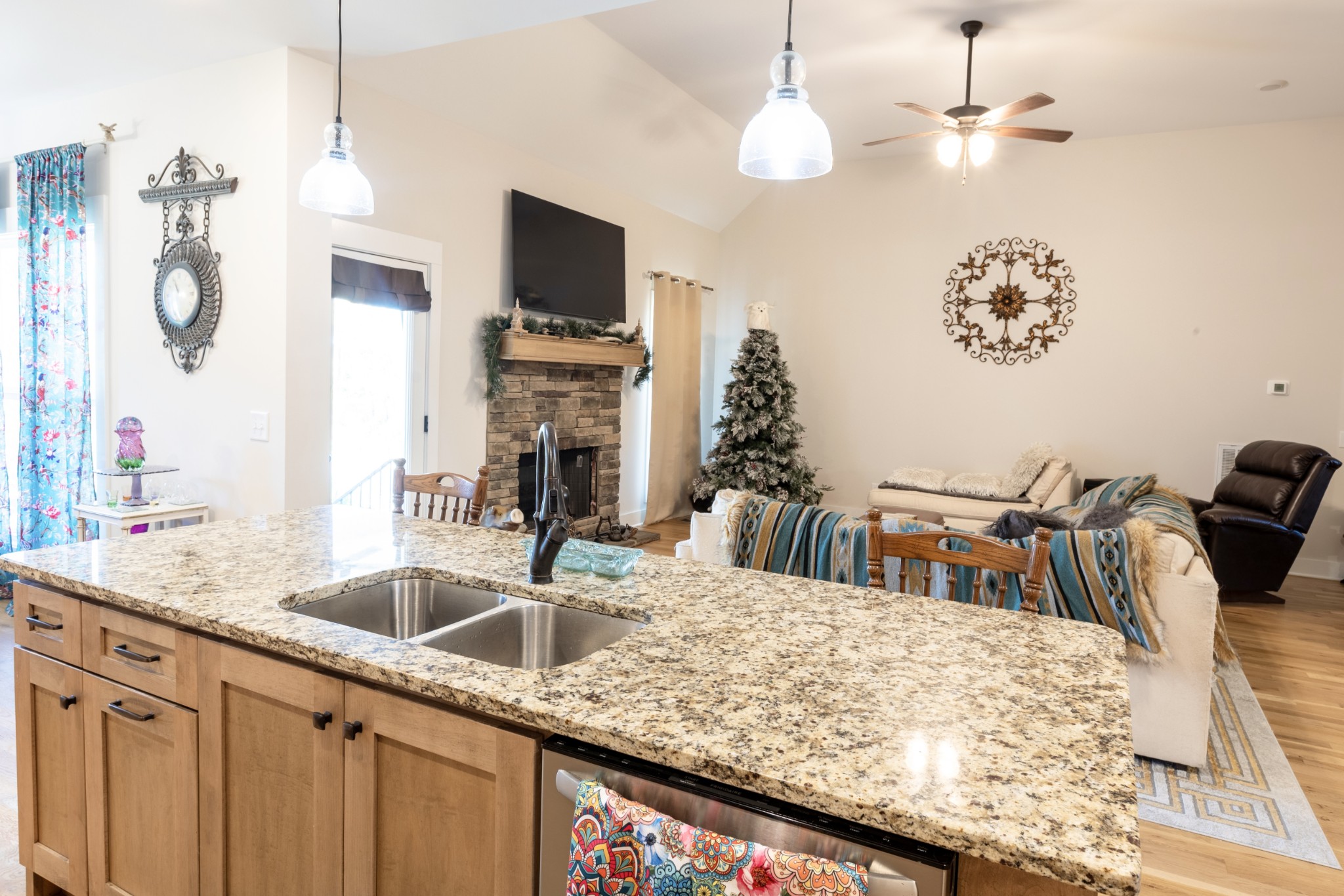 3378 New Hall Road Greenbrier, TN 37073 - Photo 30 of 67 a kitchen with kitchen island granite countertop a sink a counter top space cabinets and stainless steel appliances
