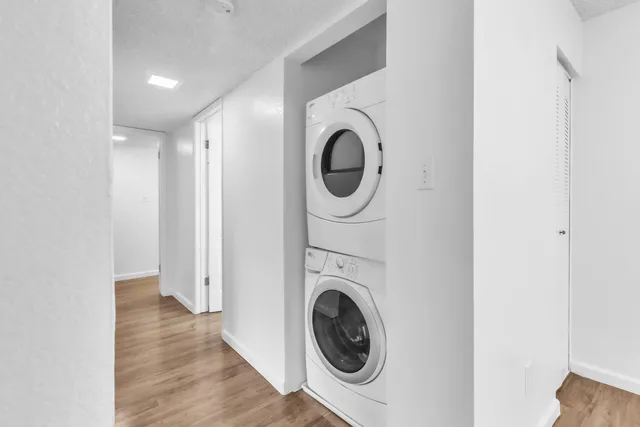 a view of a hallway with washer and dryer