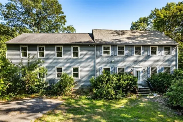 a aerial view of a house with a yard