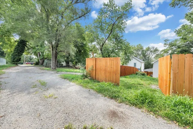 a backyard of a house with lots of green space