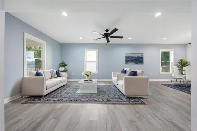 a living room with furniture and a large window