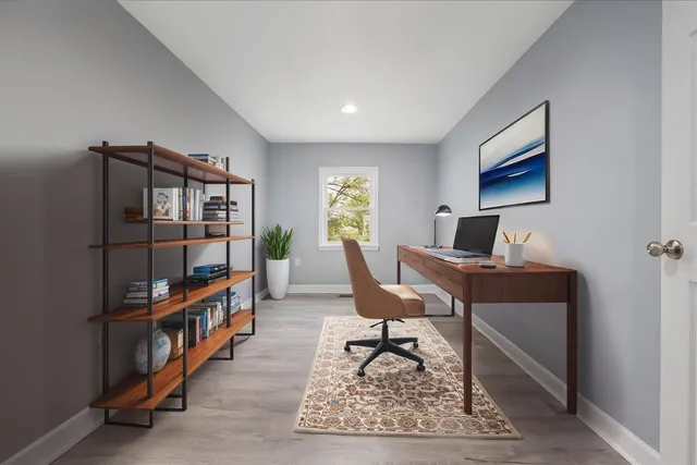 a reading room with furniture and a book shelf