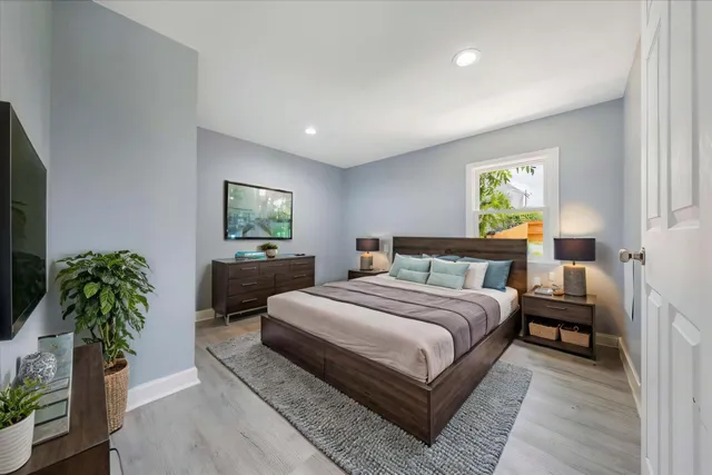 a spacious bedroom with a bed and a couch