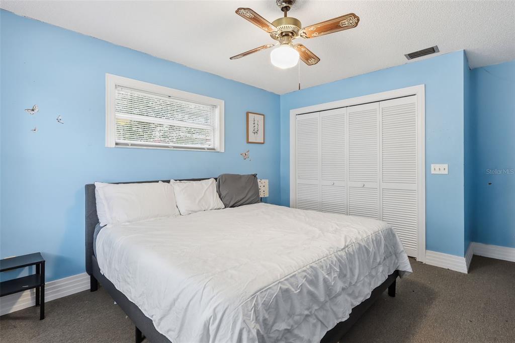 244 Angeles Road DeBary, FL 32713 - Photo 23 of 41 a bedroom with a bed and a window