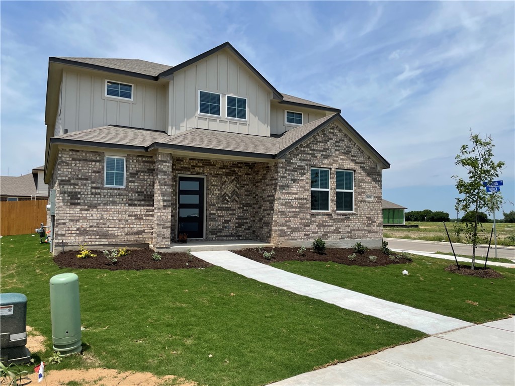 609 Paddock Lane Georgetown, TX 78626 - Photo 3 of 40 Crisp masonry craftsmanship and board-and-batten siding define this newly constructed multi-level home.