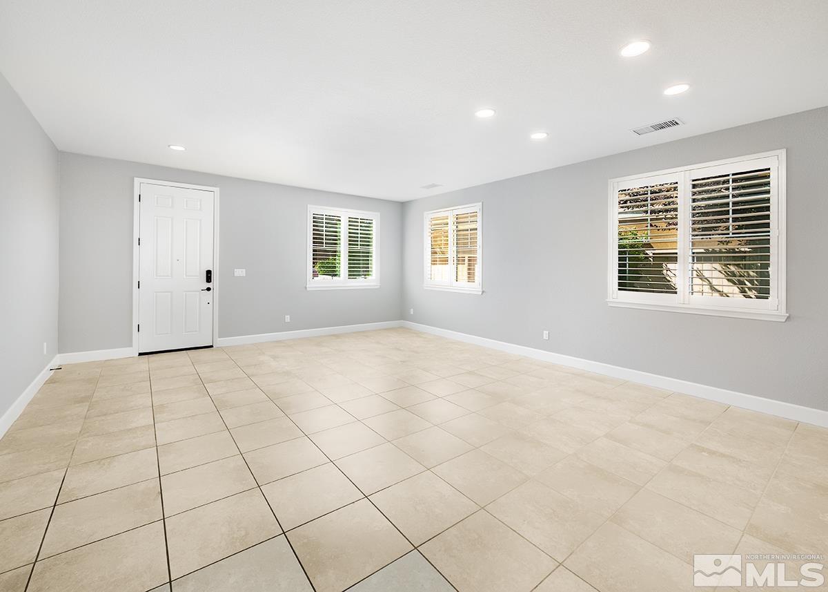 10843 Walnut Ridge Drive Reno, NV 89521 - Photo 7 of 26 a view of an empty room with a window