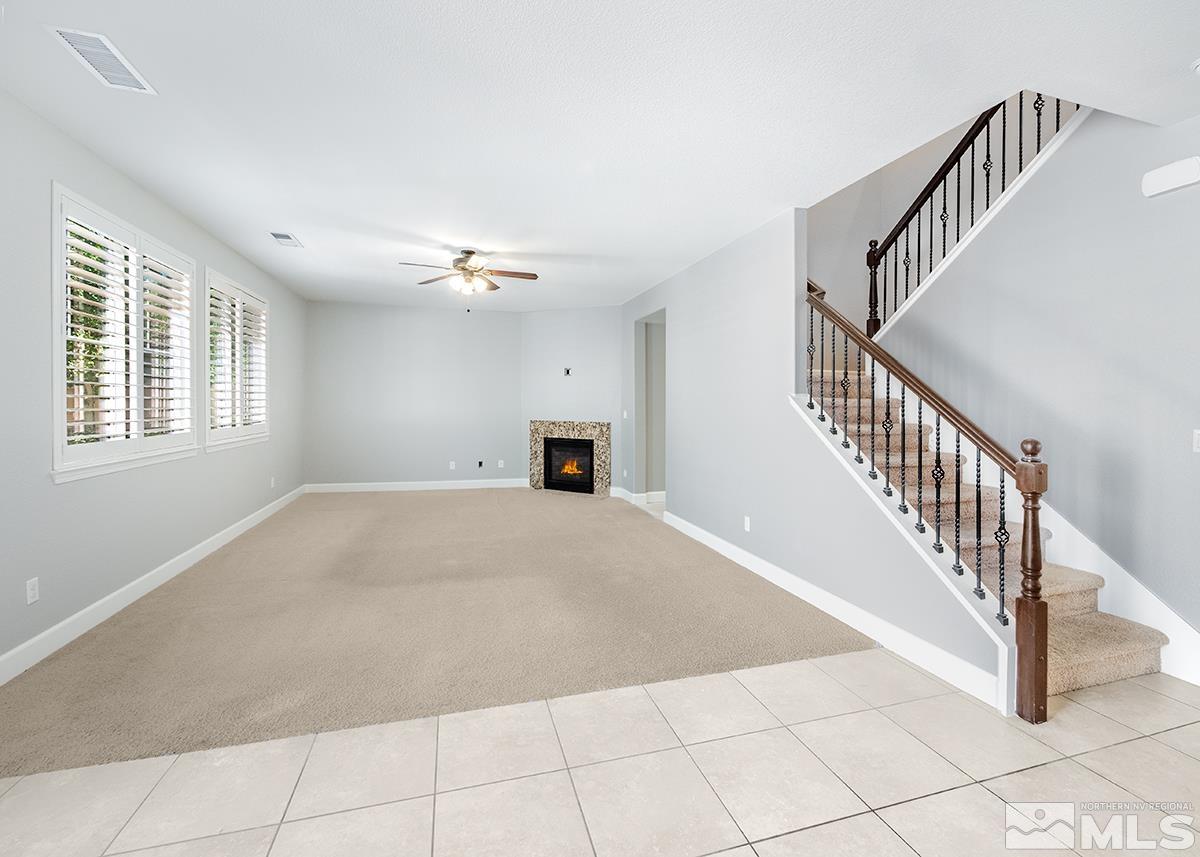 10843 Walnut Ridge Drive Reno, NV 89521 - Photo 9 of 26 a view of an empty room with a window