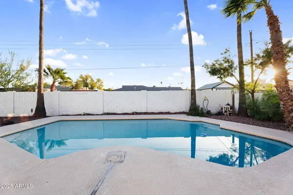 a view of swimming pool with a back yard