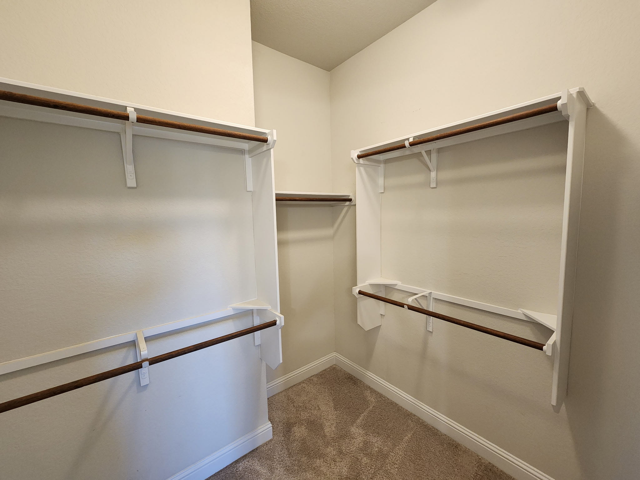 313 Gaida Loop Georgetown, TX 78628 - Photo 11 of 20 Well-appointed walk-in closet with ample shelving and hanging space for optimal organization.