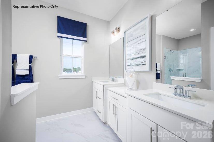 2275 Flicker Road Indian Land, SC 29707 - Photo 7 of 17 a bathroom with a double vanity sink and a window