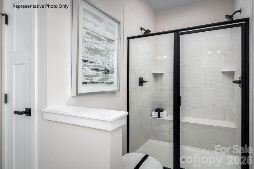 2275 Flicker Road Indian Land, SC 29707 - Photo 8 of 17 a bathroom with a shower and a sink