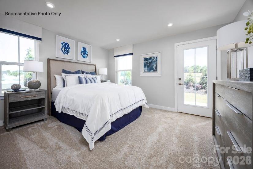 2275 Flicker Road Indian Land, SC 29707 - Photo 9 of 17 a bedroom with a bed and a cabinets