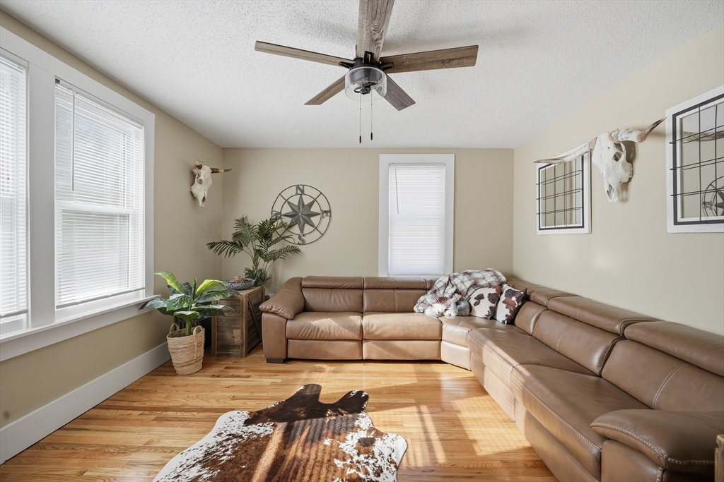 3076 Boston Road Wilbraham, MA 01095 - Photo 13 of 42 a living room with furniture flowerpot and a window