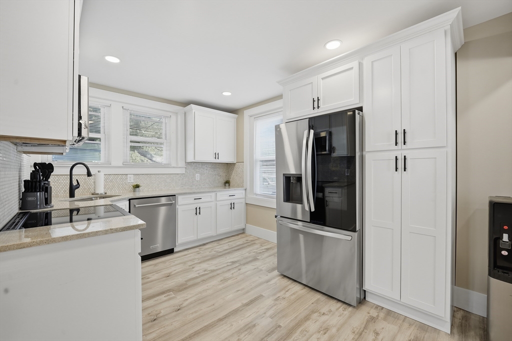 3076 Boston Road Wilbraham, MA 01095 - Photo 2 of 42 a kitchen with granite countertop stainless steel appliances and wooden cabinets