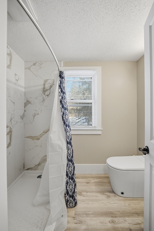 3076 Boston Road Wilbraham, MA 01095 - Photo 21 of 42 a bathroom with a toilet and a shower