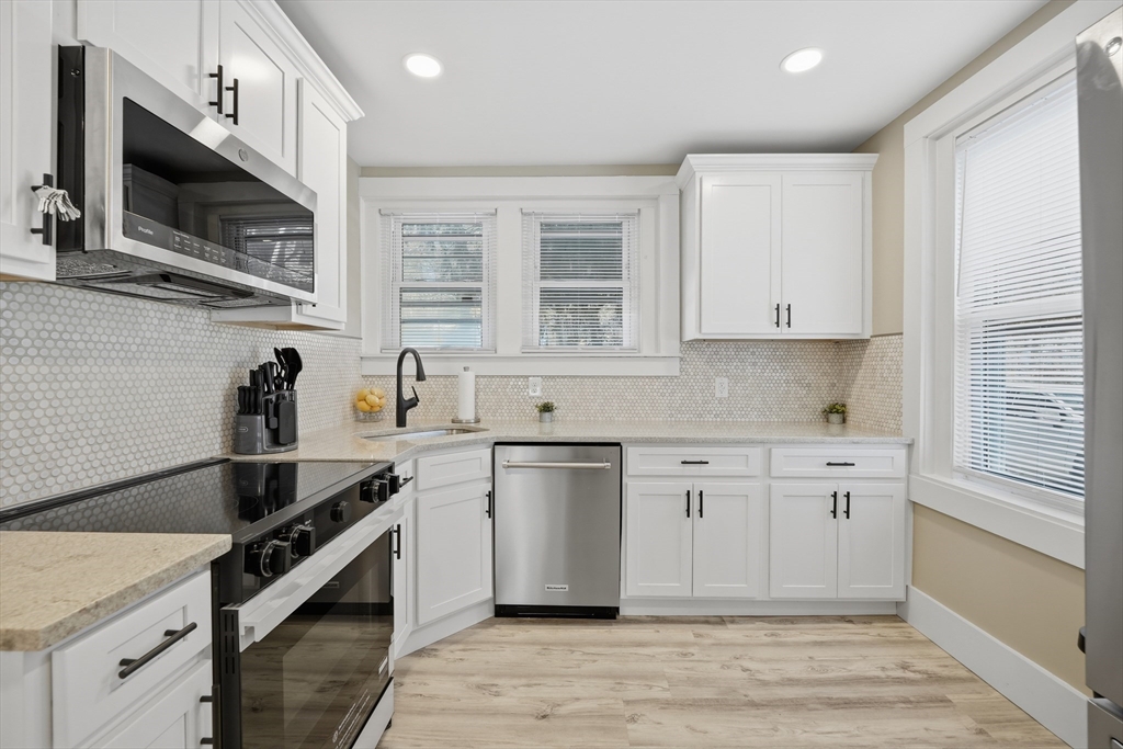 3076 Boston Road Wilbraham, MA 01095 - Photo 3 of 42 a kitchen with stainless steel appliances white cabinets a sink and a stove