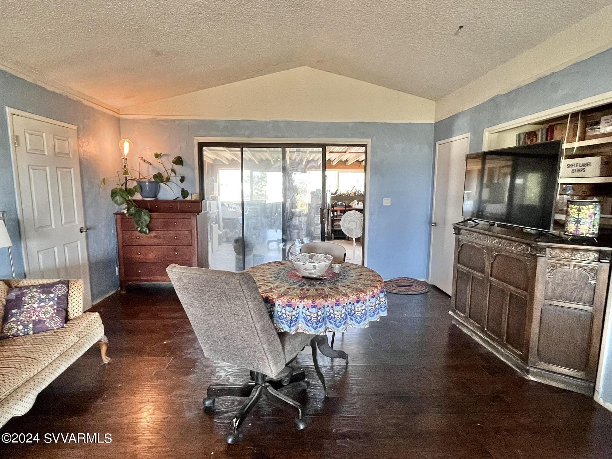 4545 North Drifting Sands Road Rimrock, AZ 86335 - Photo 13 of 52 a view of a dining room with furniture window and wooden floor
