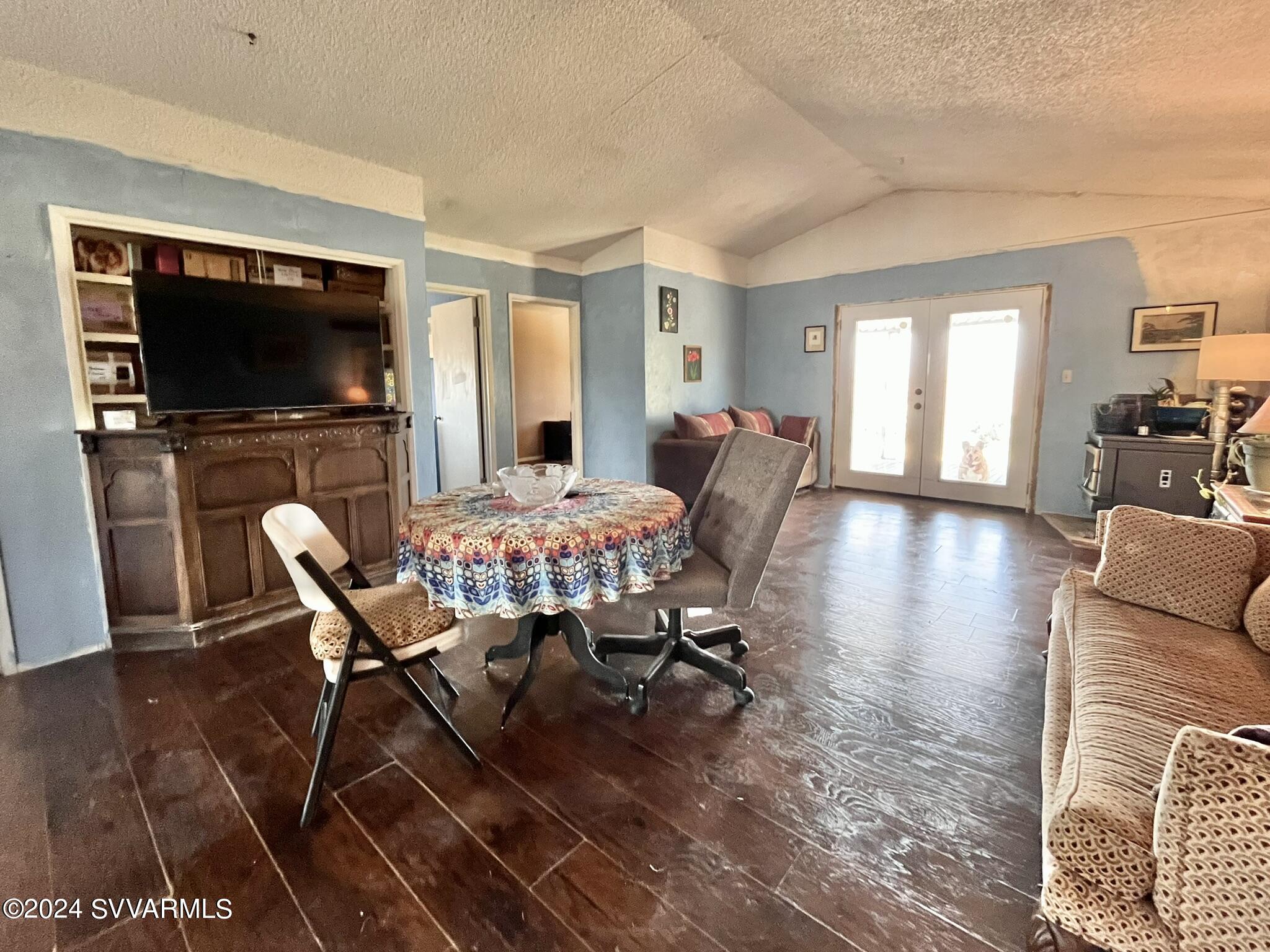 4545 North Drifting Sands Road Rimrock, AZ 86335 - Photo 14 of 52 a view of a dining room with furniture window and wooden floor