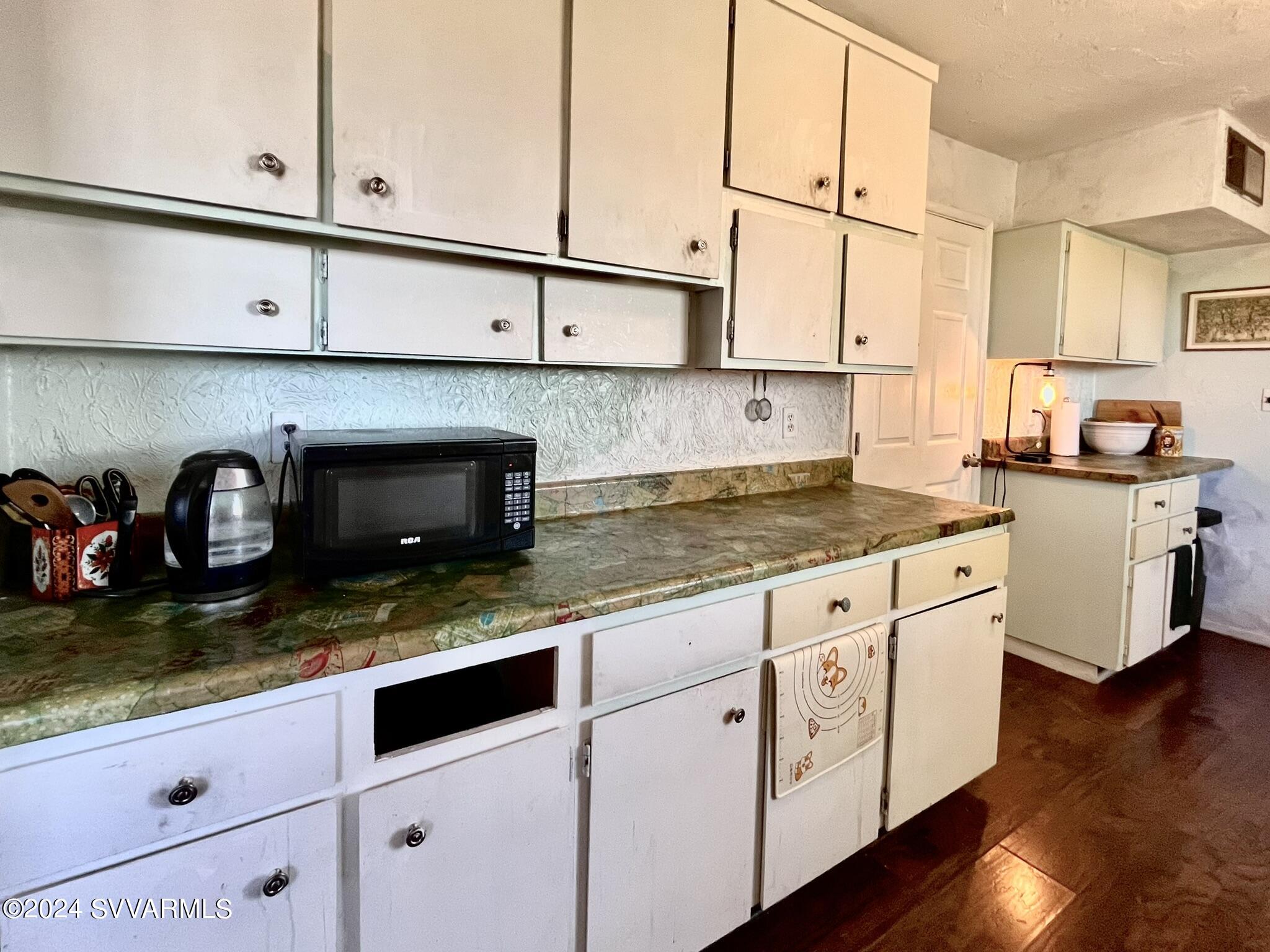 4545 North Drifting Sands Road Rimrock, AZ 86335 - Photo 18 of 52 a kitchen with stainless steel appliances granite countertop a sink stove and cabinets