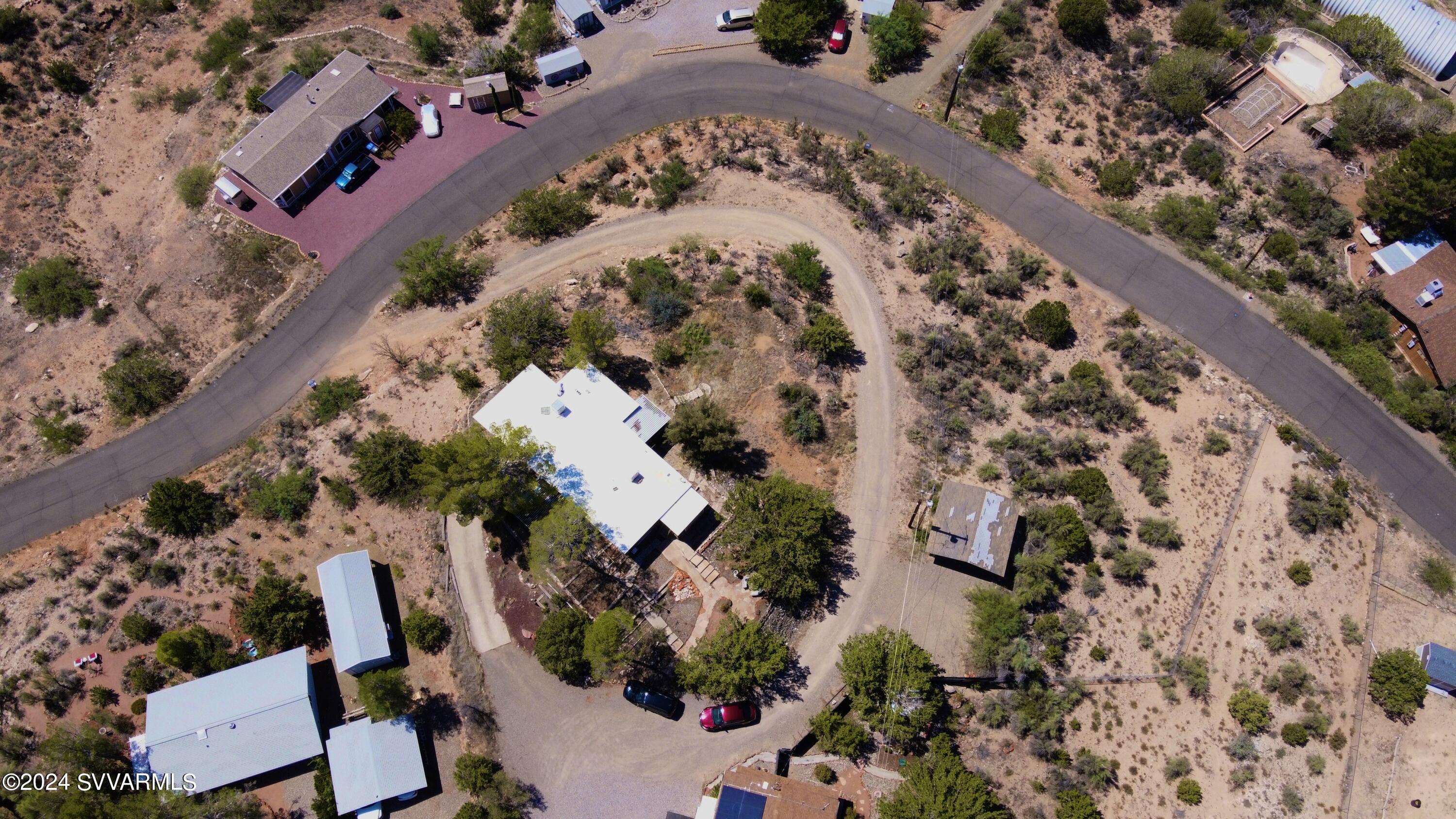 4545 North Drifting Sands Road Rimrock, AZ 86335 - Photo 2 of 52 an aerial view of a house with a yard and garden