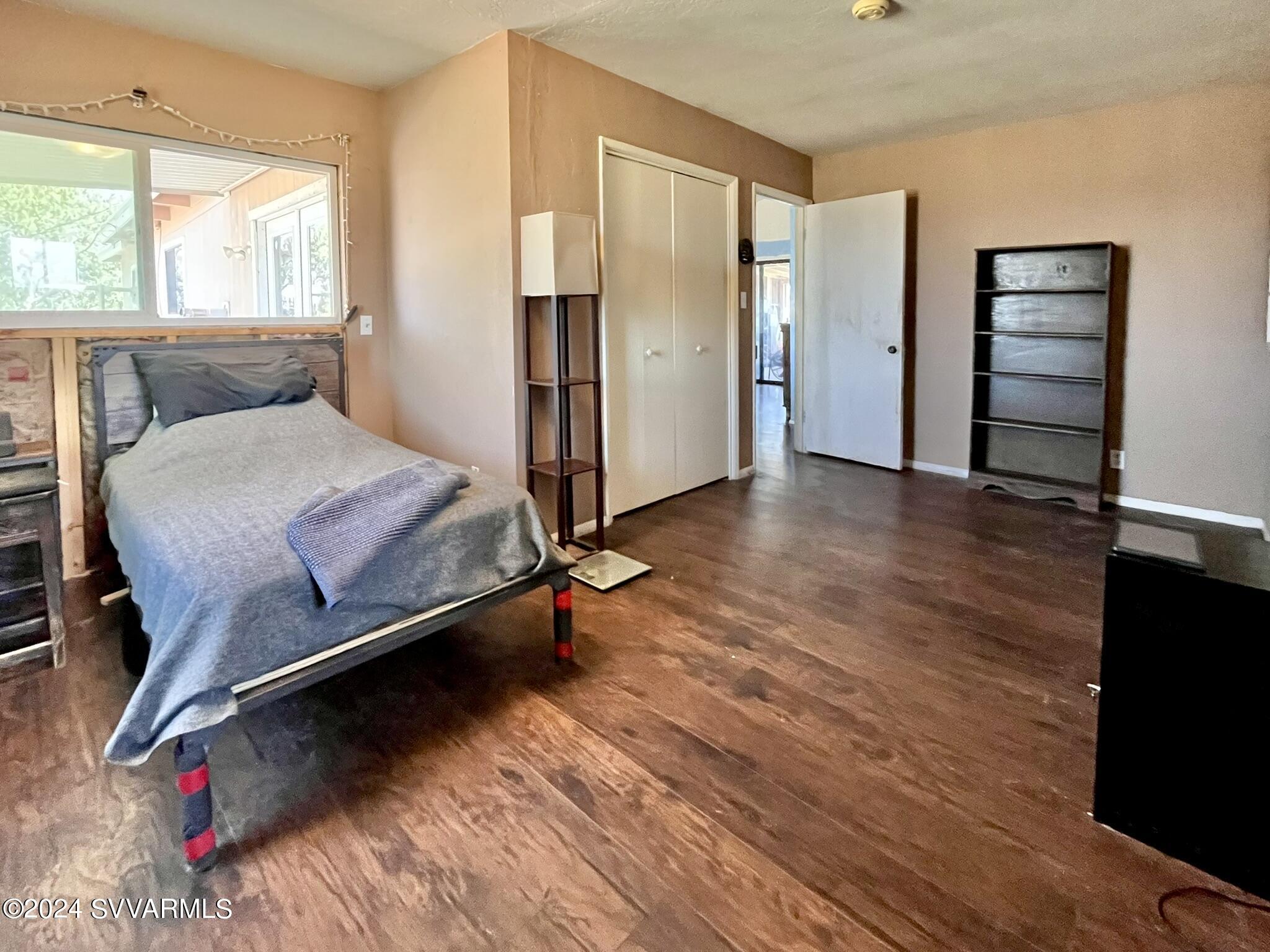4545 North Drifting Sands Road Rimrock, AZ 86335 - Photo 28 of 52 a room with wooden floor and a window