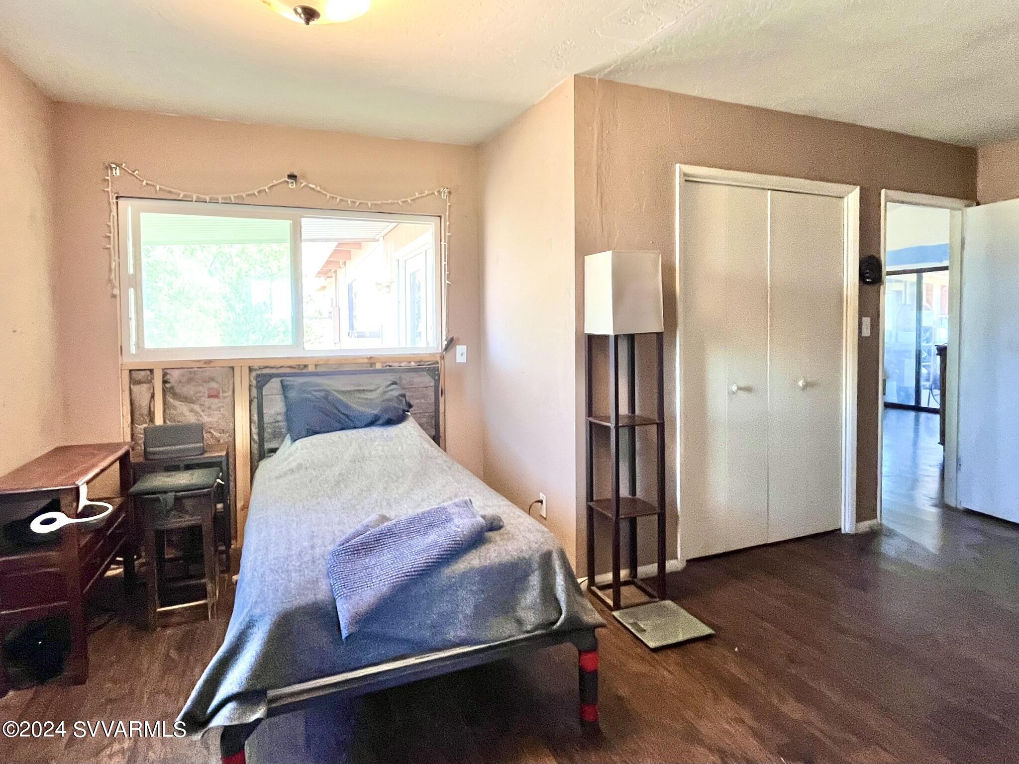 4545 North Drifting Sands Road Rimrock, AZ 86335 - Photo 29 of 52 a room with gym equipment and wooden floor