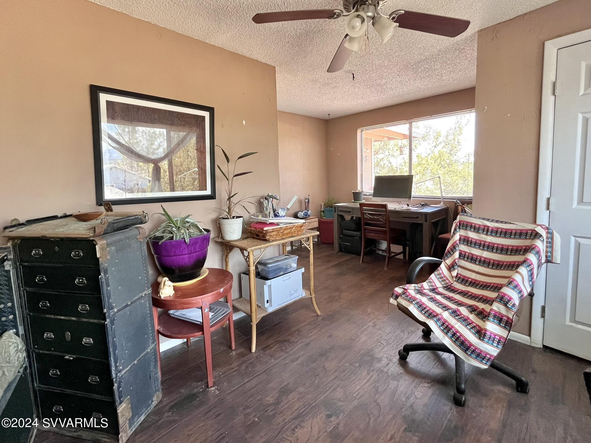 4545 North Drifting Sands Road Rimrock, AZ 86335 - Photo 32 of 52 a room with furniture and wooden floor