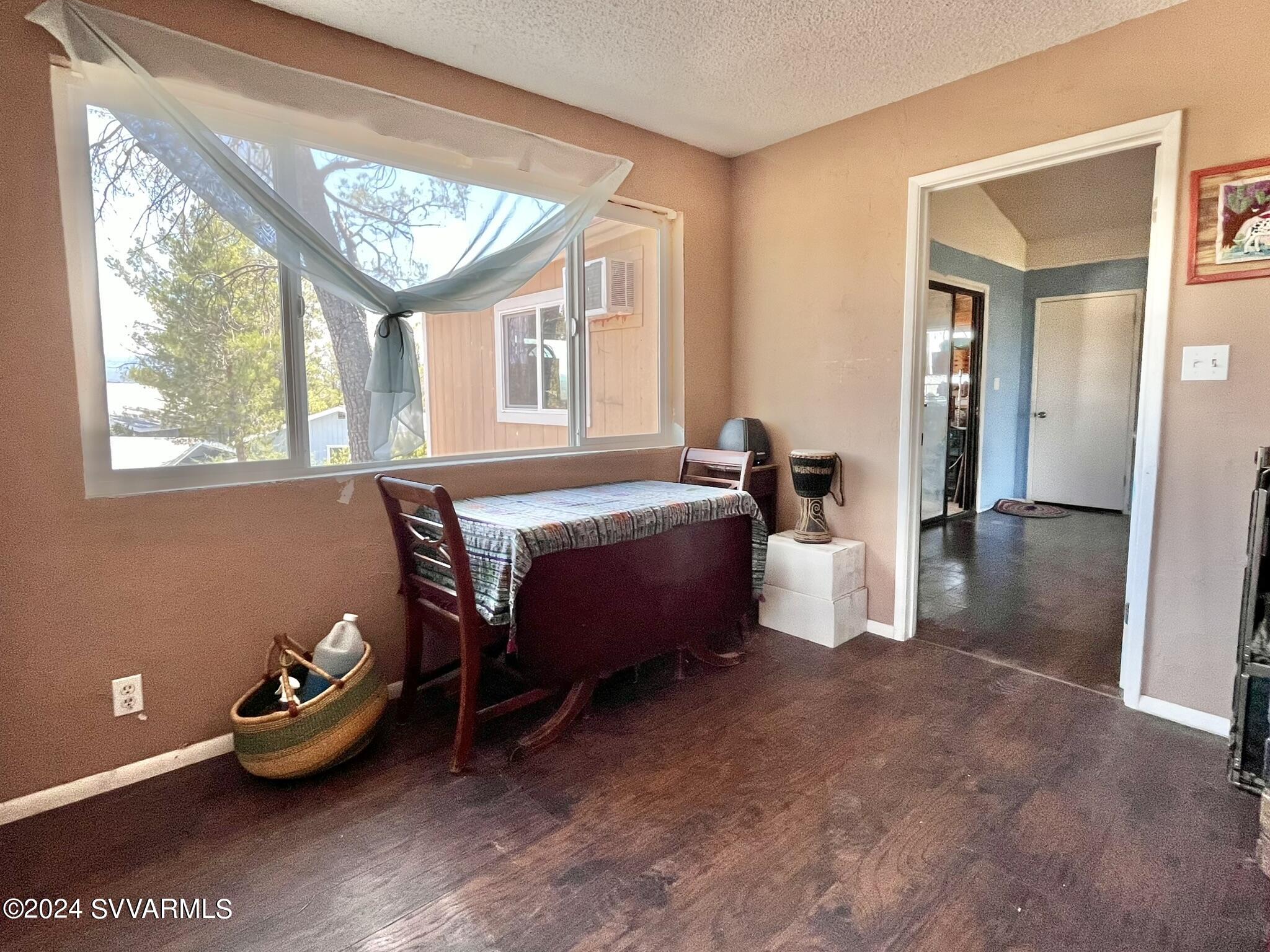 4545 North Drifting Sands Road Rimrock, AZ 86335 - Photo 33 of 52 a spacious bedroom with a bed and a window