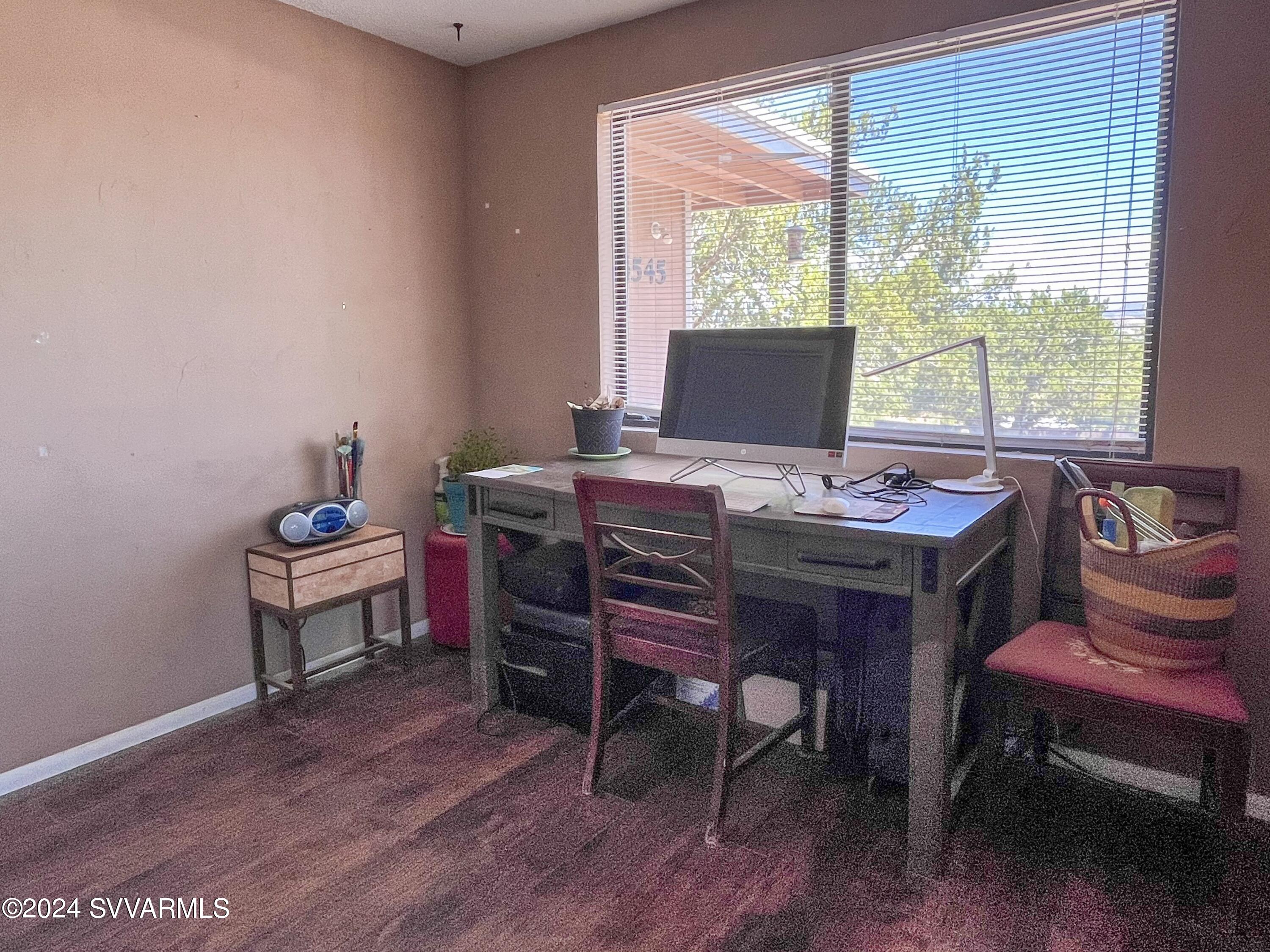 4545 North Drifting Sands Road Rimrock, AZ 86335 - Photo 34 of 52 a view of a workspace with furniture and a window