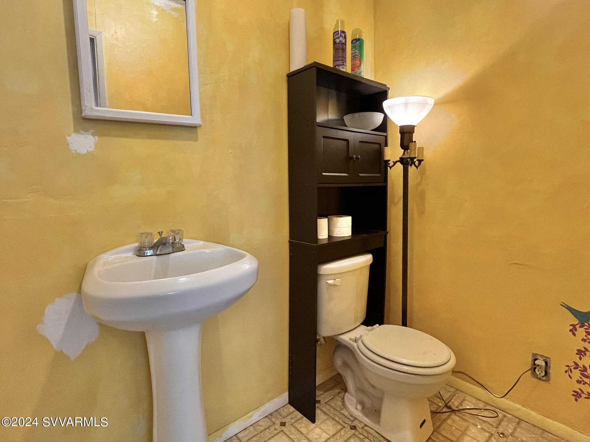 4545 North Drifting Sands Road Rimrock, AZ 86335 - Photo 35 of 52 a bathroom with a sink and a toilet