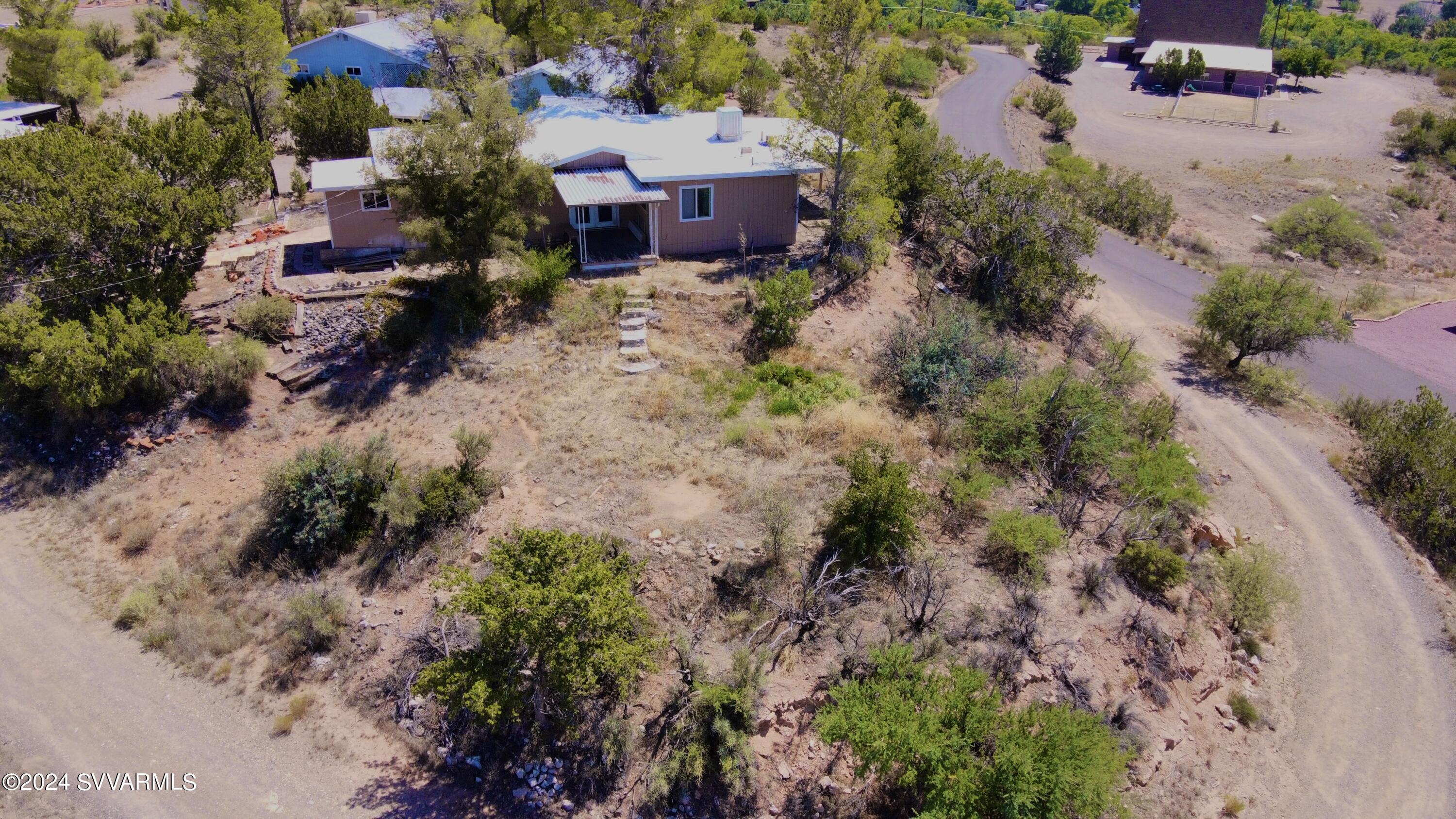 4545 North Drifting Sands Road Rimrock, AZ 86335 - Photo 41 of 52 an aerial view of a house with a yard and greenery