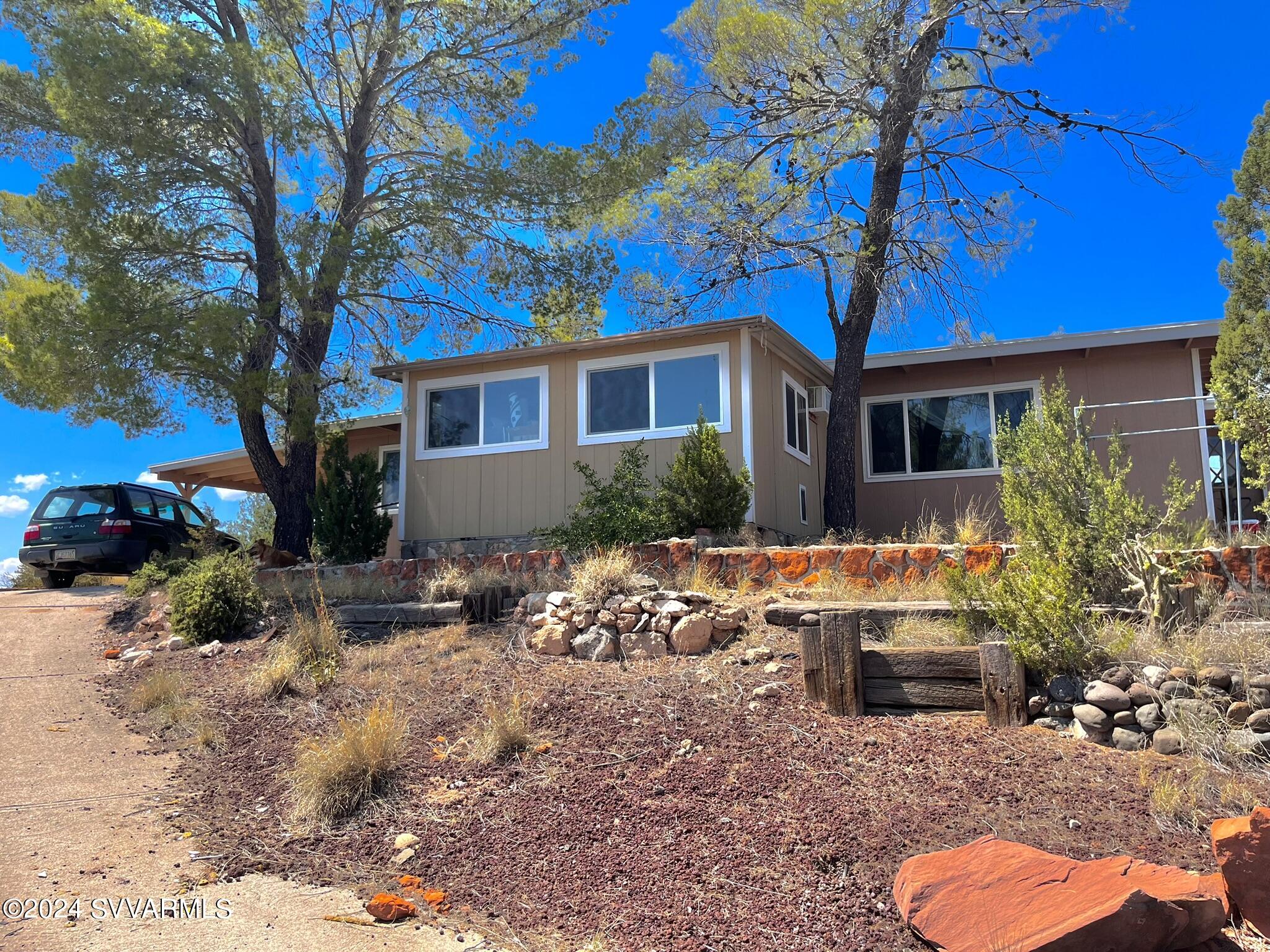 4545 North Drifting Sands Road Rimrock, AZ 86335 - Photo 47 of 52 a front view of house with yard outdoor seating and barbeque oven