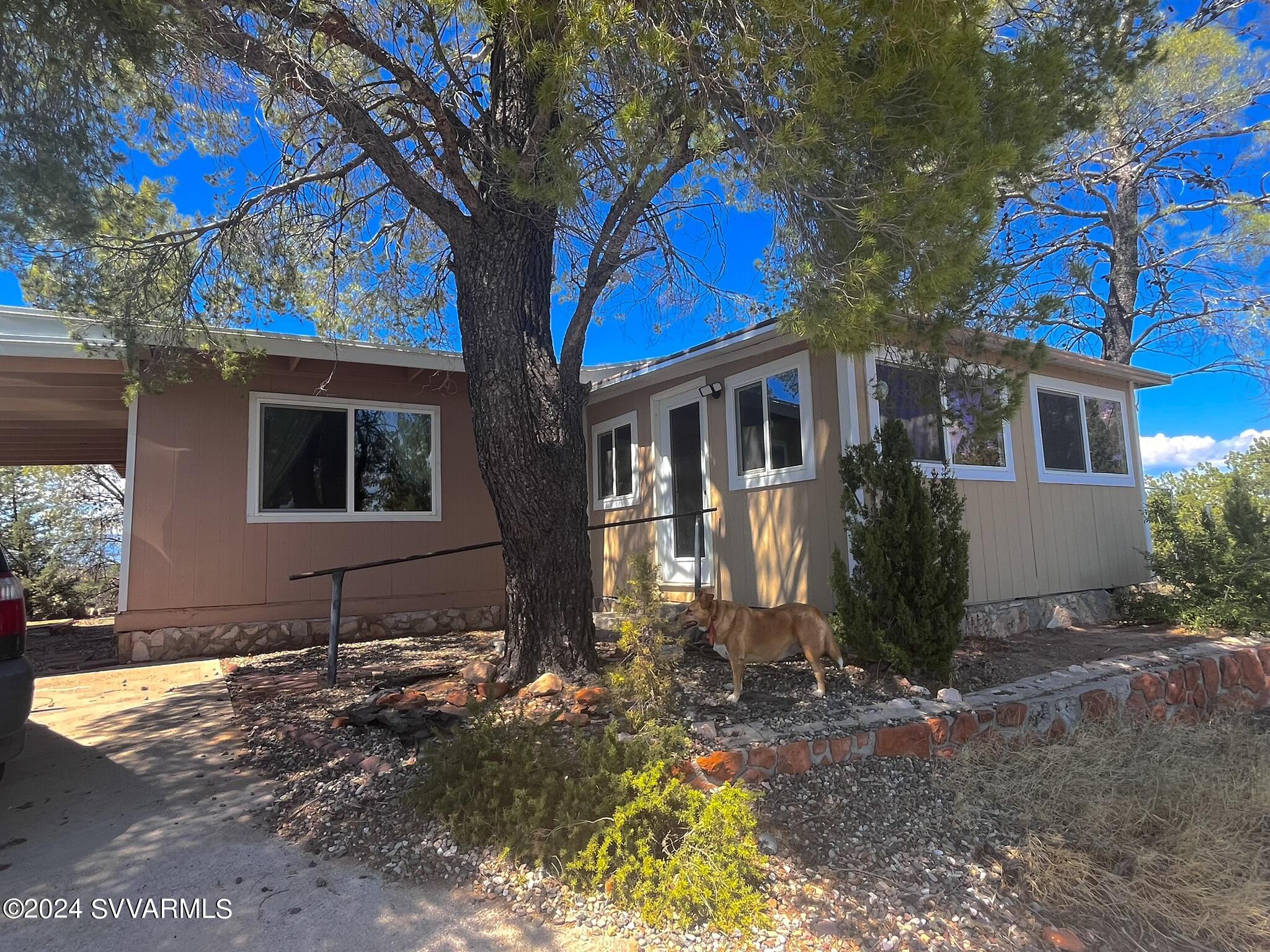 4545 North Drifting Sands Road Rimrock, AZ 86335 - Photo 52 of 52 a front view of a house with a yard