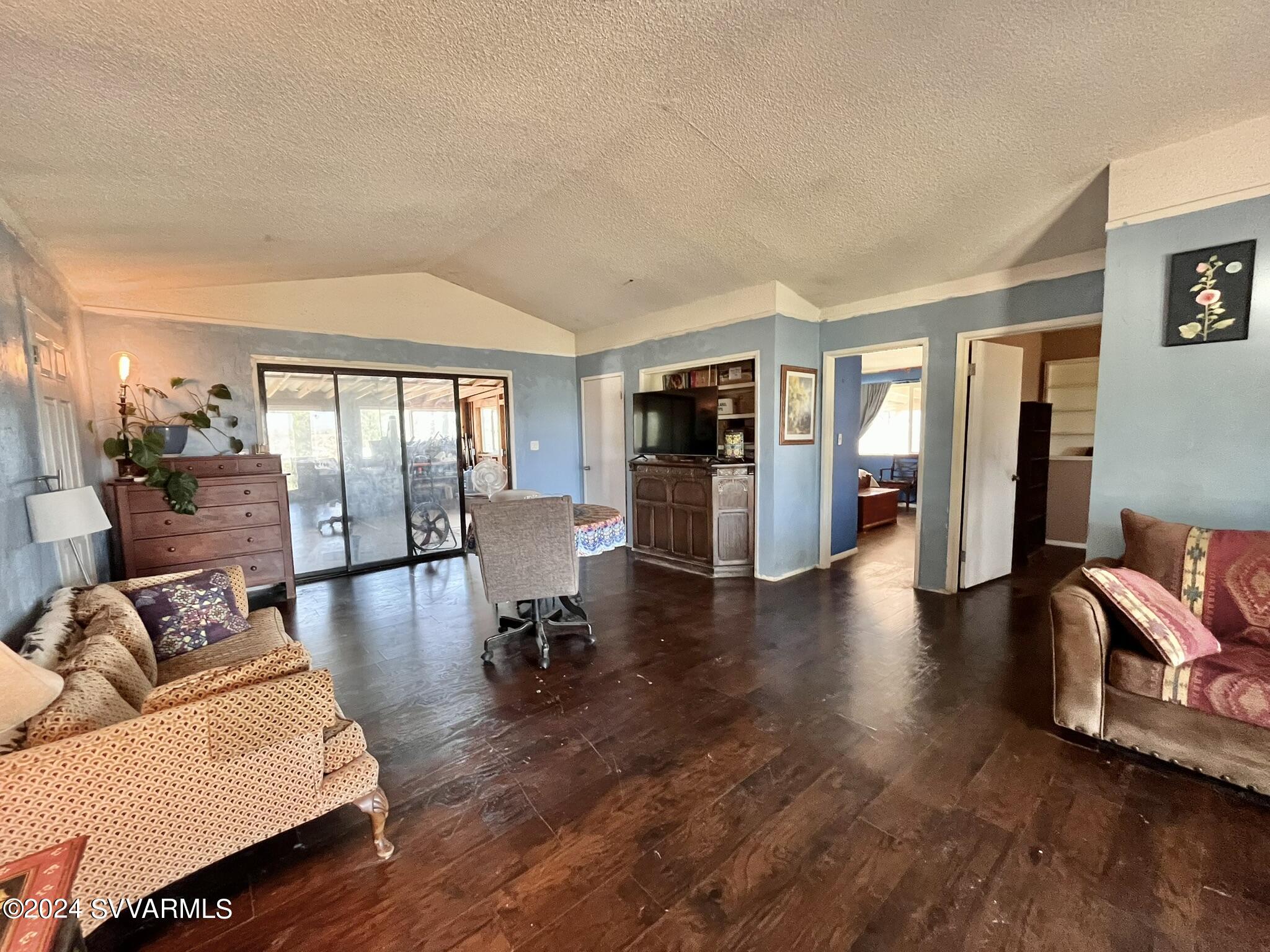 4545 North Drifting Sands Road Rimrock, AZ 86335 - Photo 10 of 52 a living room with furniture and a wooden floor