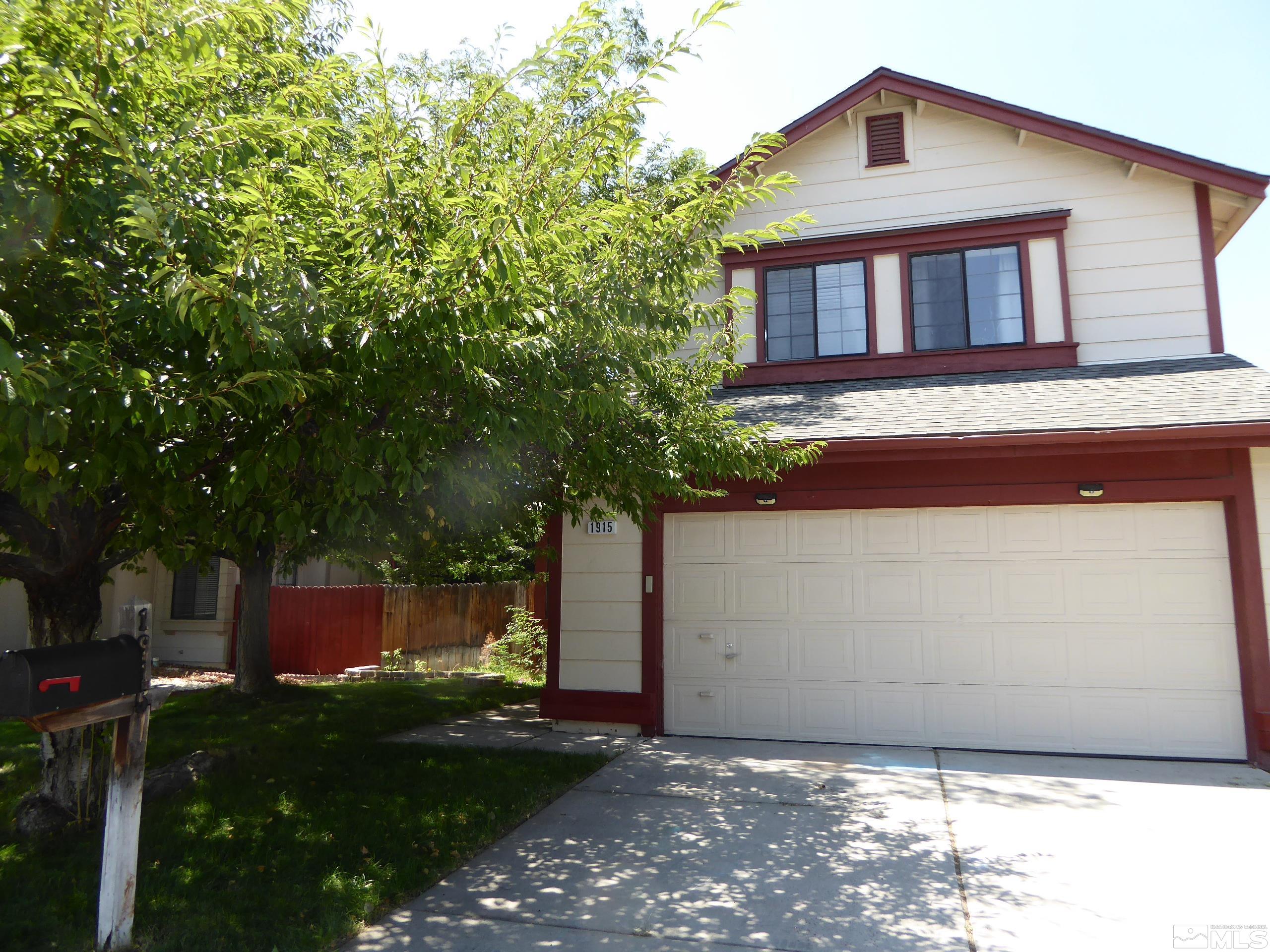1915 Amarak Way Reno, NV 89523 - Photo 2 of 25 a front view of a house with garden